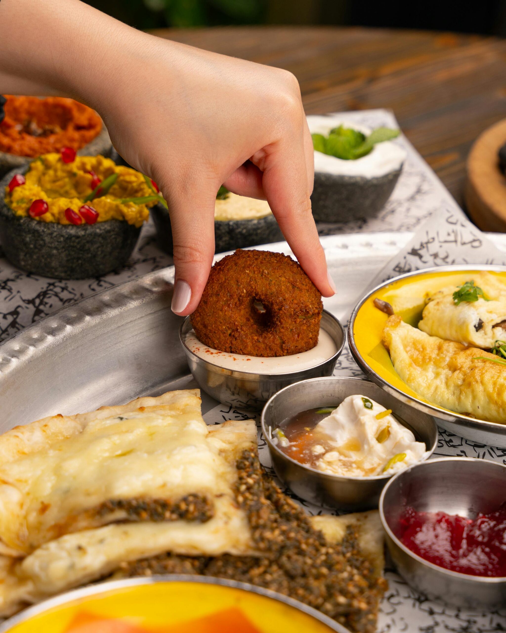 An Indian thali featuring a variety of traditional dishes served on a metal plate.